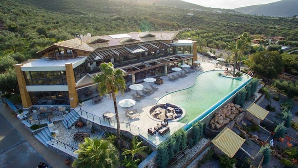 A resort with a swimming pool, outdoor seating, and a restaurant. - Anthidon Estate (Chalcis)