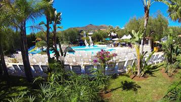 Seasonal outdoor pool, pool umbrellas, pool loungers