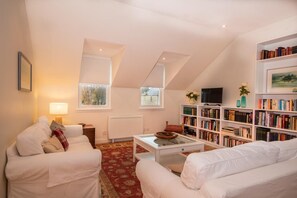 Flat-screen TV, DVD player, books