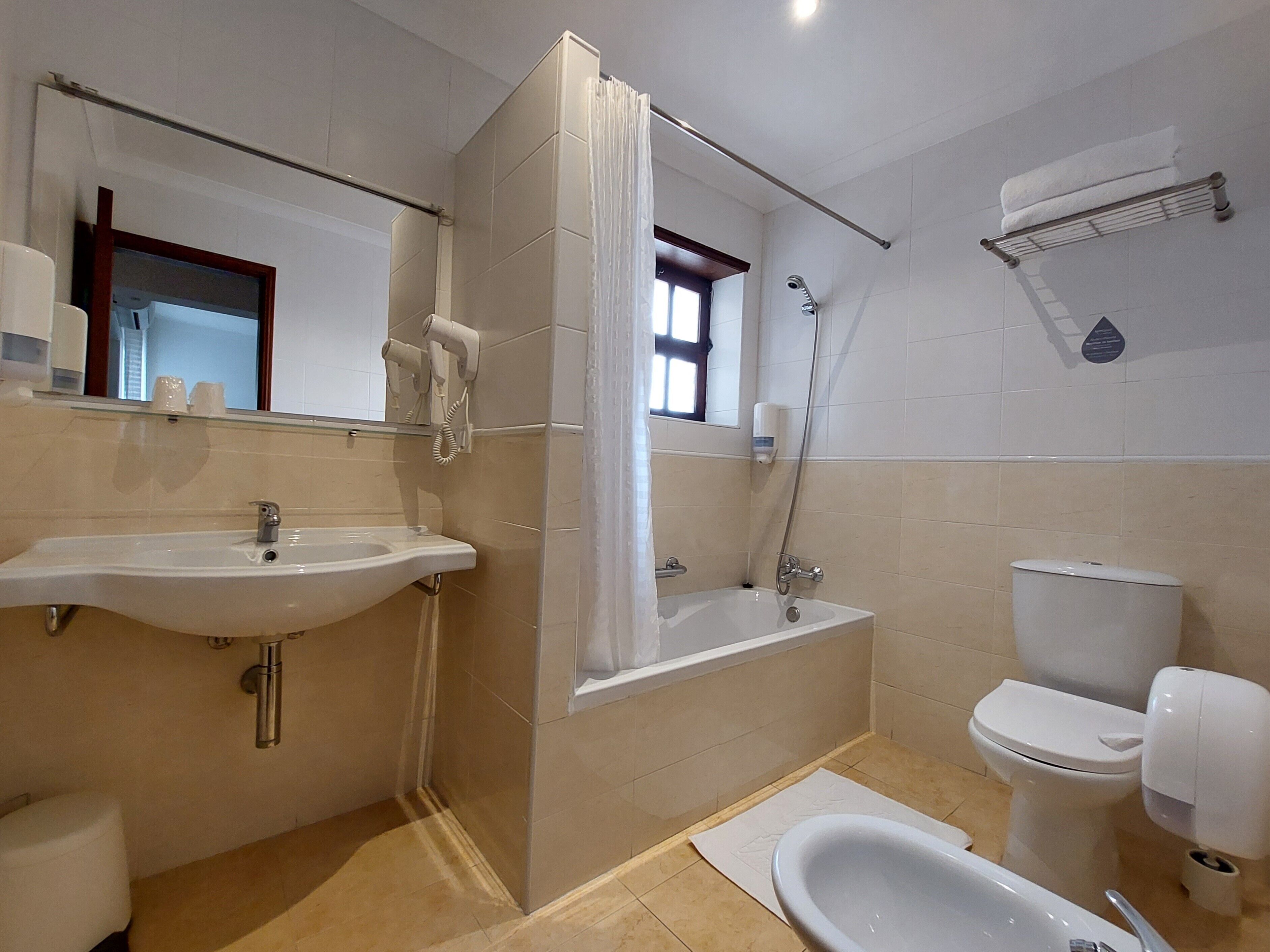 twin room | bathroom | hair dryer, towels, soap, shampoo