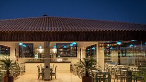 A restaurant with a tiled roof, outdoor seating, and a sign reading "massafina pizzeria artesanal". - Vila Galé Resort Touros - All Inclusive (Touros)