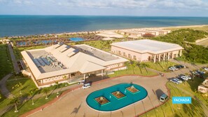 A large hotel with multiple buildings, a swimming pool, and a beach view. - Vila Galé Resort Touros - All Inclusive (Touros)