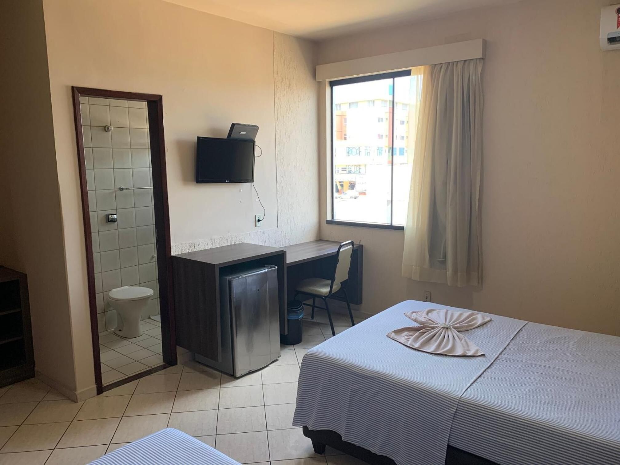 minibar, desk, blackout curtains, iron/ironing board