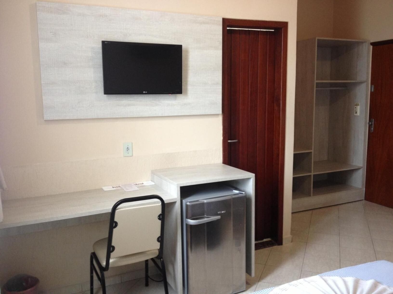 minibar, desk, blackout curtains, iron/ironing board