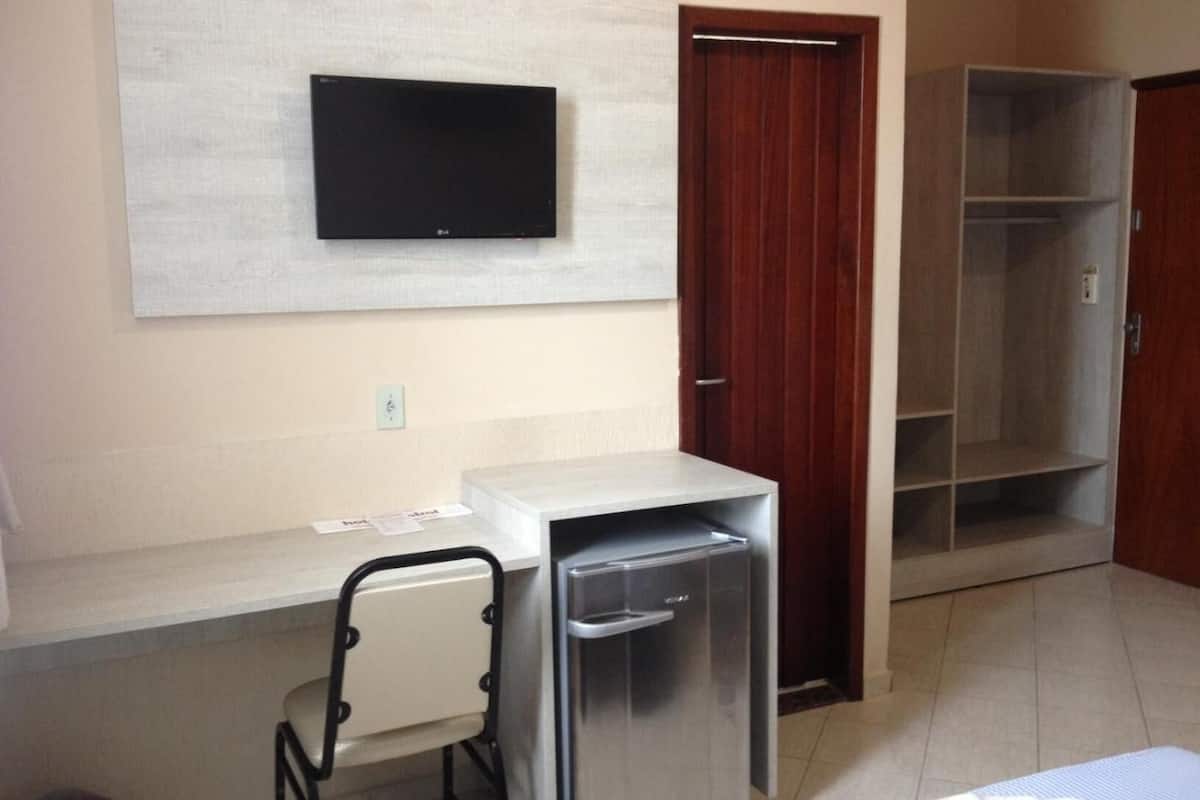 minibar, desk, blackout curtains, iron/ironing board