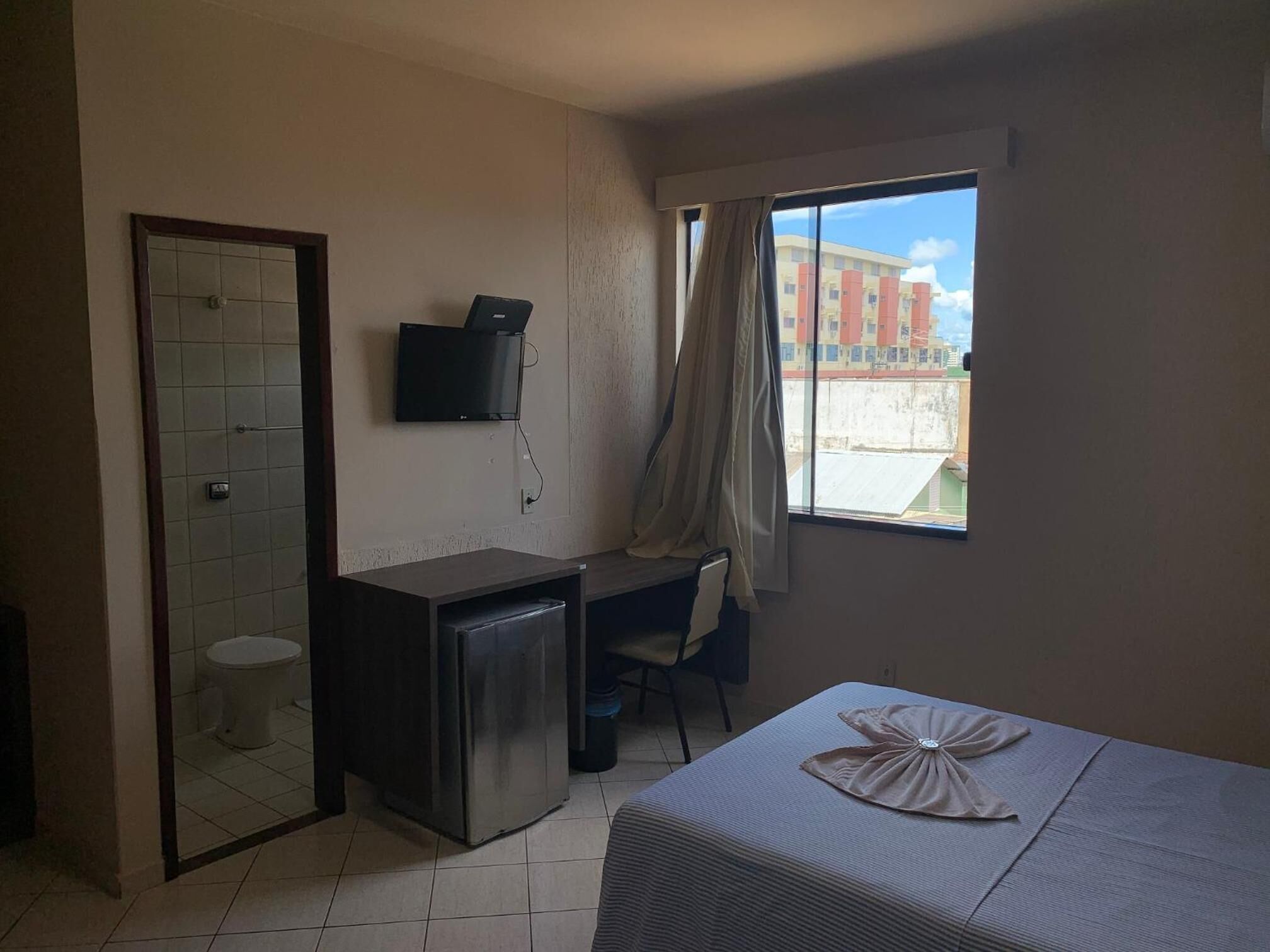 minibar, desk, blackout curtains, iron/ironing board