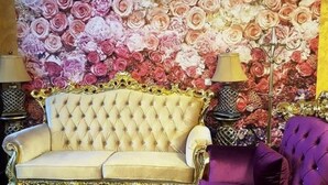 A luxurious room with a tufted sofa, a purple armchair, and a floral wall backdrop. - Elit Palace Hotel & Spa (Balchik)