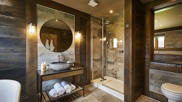 Shower, designer toiletries, hair dryer, towels