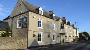 A building with the sign "Kings Arms" indicating a pub or inn. - The Kings Arms (Badminton)