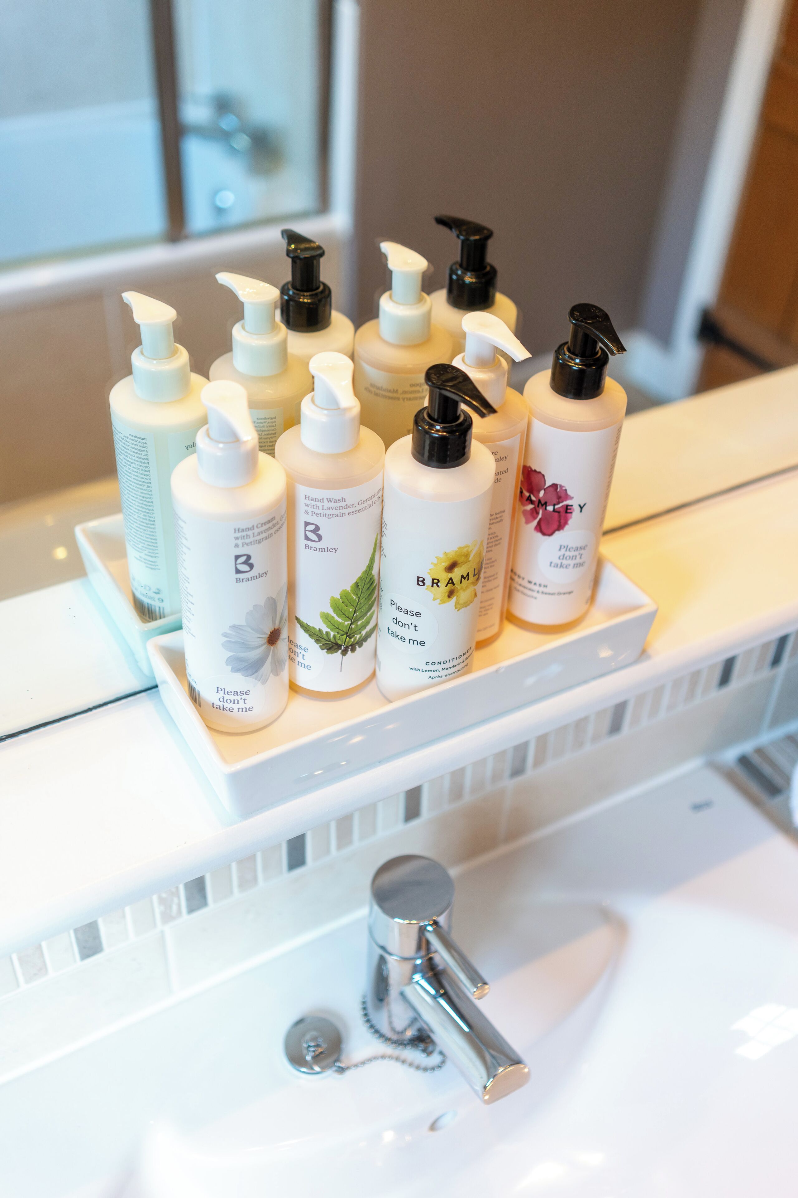 A bathroom shelf with various toiletries.