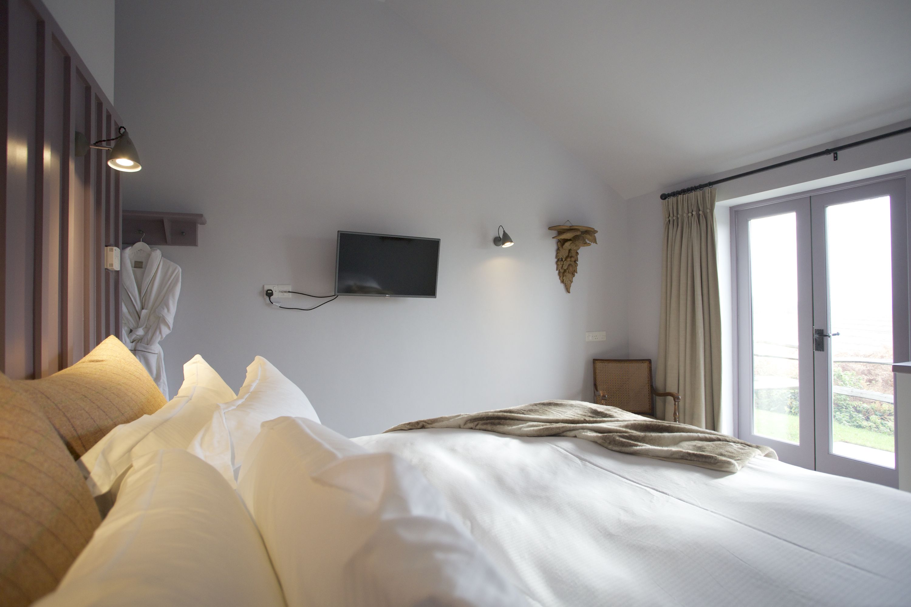 signature room | egyptian cotton sheets, premium bedding, down duvets, iron/ironing board