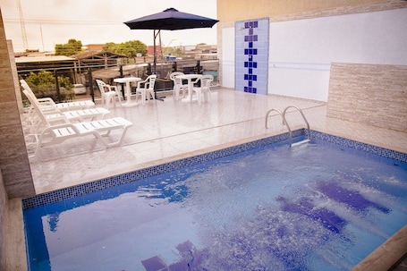 Outdoor pool, open 10:00 AM to 10:00 PM, sun loungers