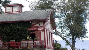 A traditional building with a sign reading "ENTRANCE." - Rockaway Shores (Rockaway Beach)