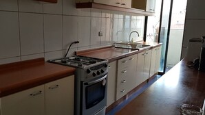 Apartment, 3 Bedrooms | Private kitchen | Fridge, oven, stovetop, cookware/dishes/utensils