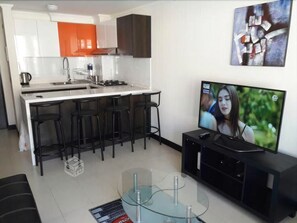 Apartment, 2 Bedrooms | Living area | Flat-screen TV