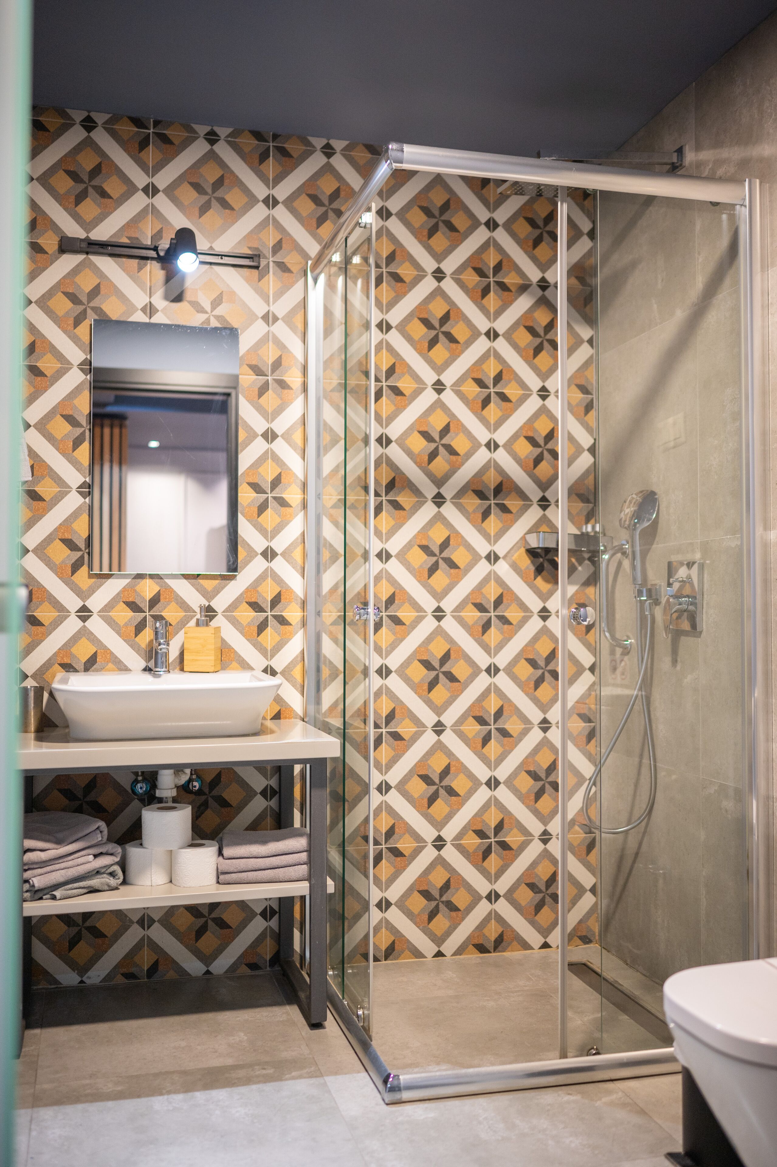 shower, rainfall showerhead, hair dryer, towels