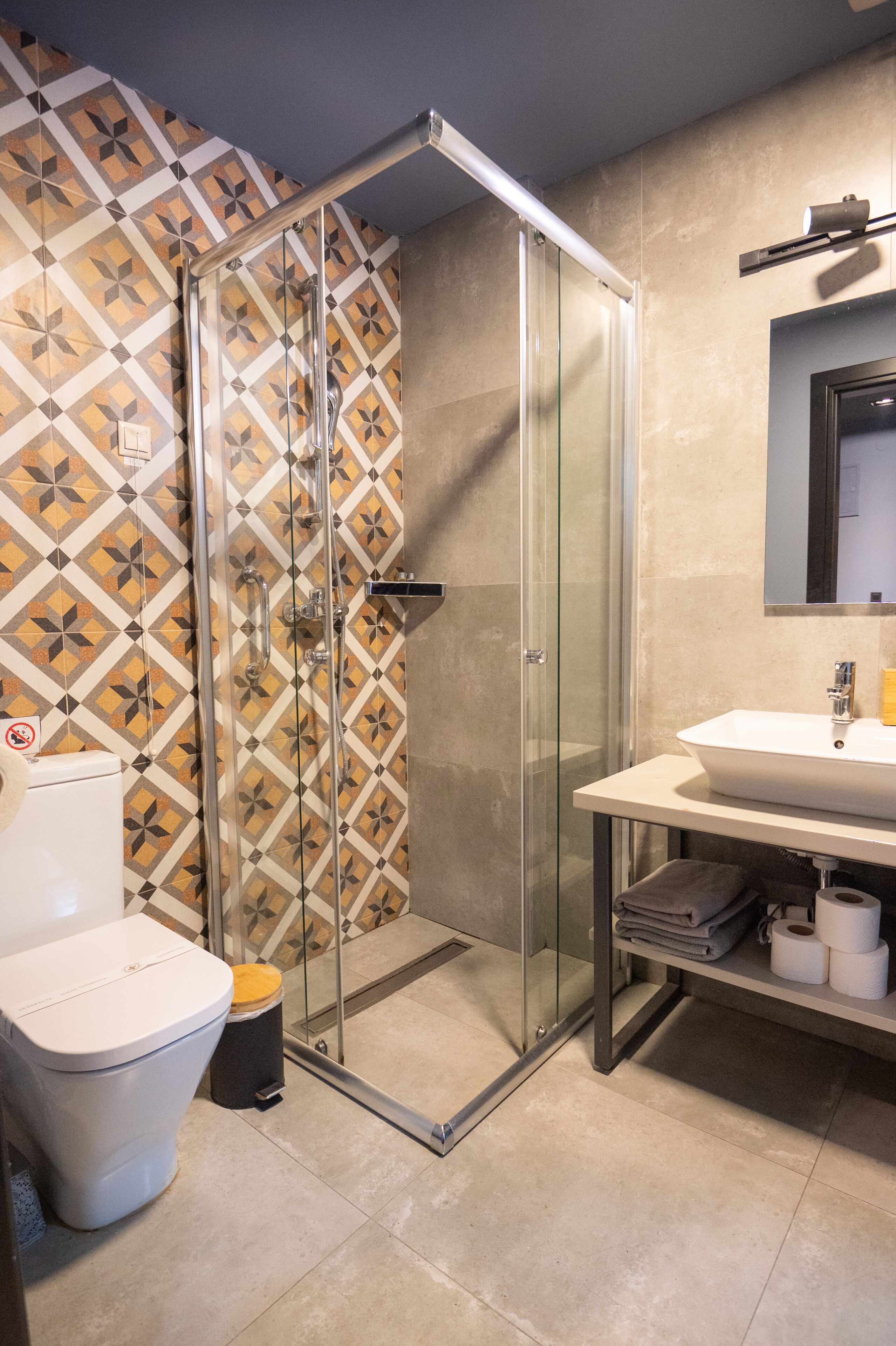 shower, rainfall showerhead, hair dryer, towels