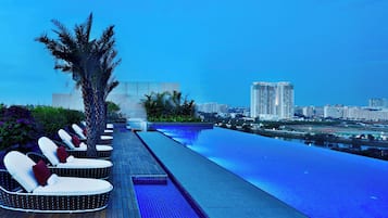 Outdoor pool, open 6:00 AM to 10:00 PM, pool loungers