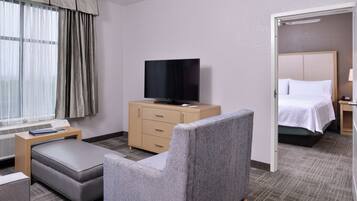 Premium bedding, down comforters, blackout drapes, iron/ironing board