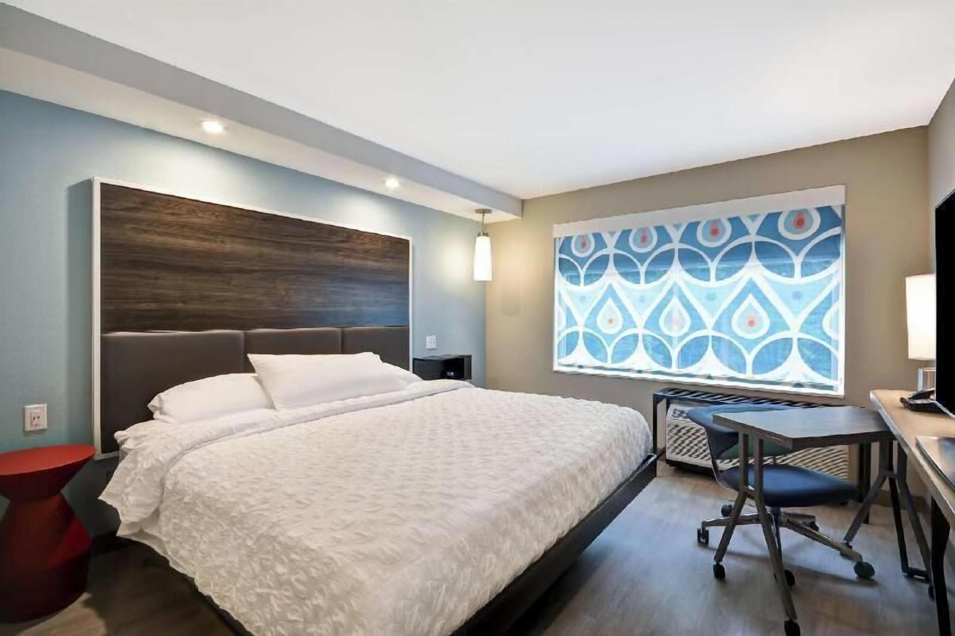 Premium bedding, down comforters, blackout drapes, iron/ironing board