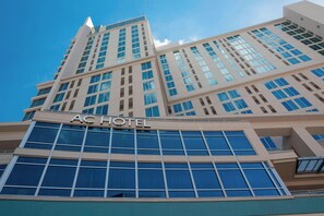 A hotel with a modern design, featuring a prominent "AC HOTEL" sign at the top. - AC Hotels by Marriott Charlotte City Center (Charlotte)