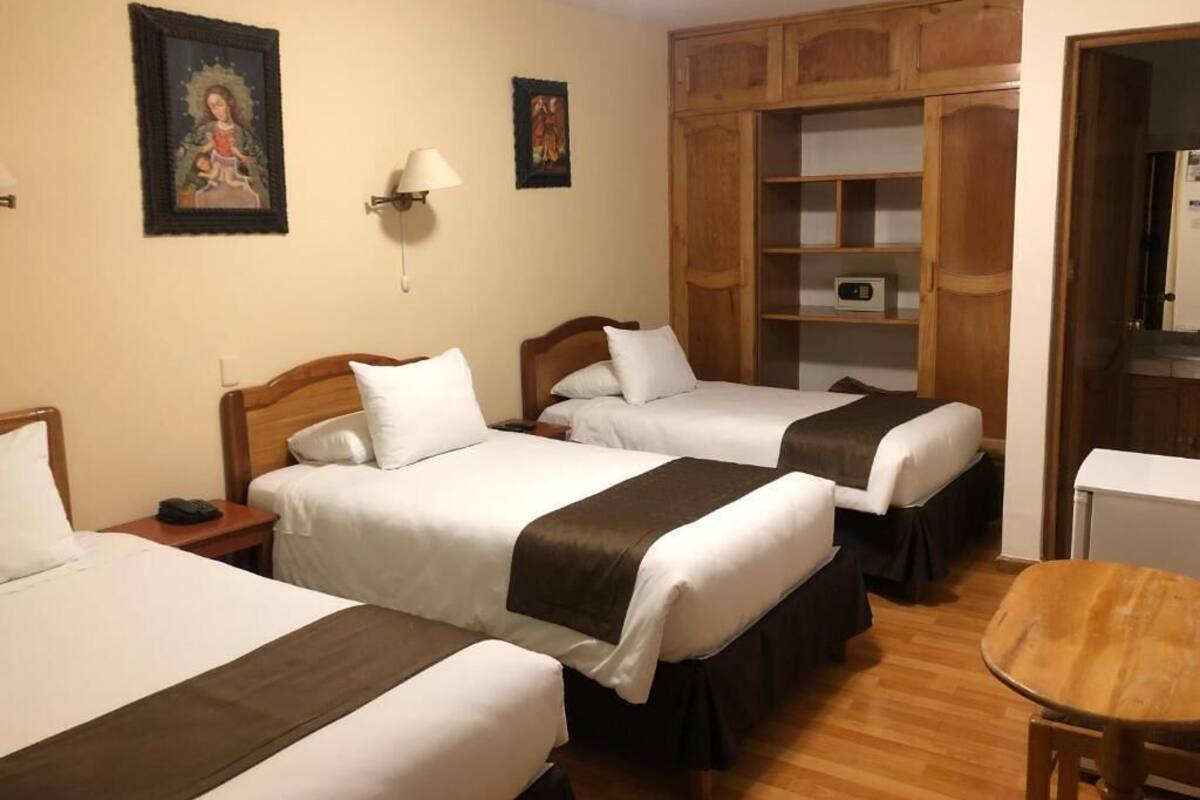 Quadruple Room | Minibar, in-room safe, desk, soundproofing
