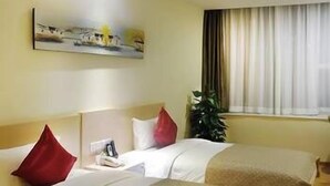 A hotel room with two beds, a painting on the wall, a window with curtains, and a plant. - Shenzhen Shangpin Hotel (Shenzhen)