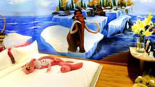 A bedroom with a bed, a nightstand, and a wall mural of a snowy landscape with a moose. - Shenzhen Shangpin Hotel (Shenzhen)