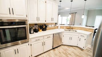 Enjoy cooking in this well-equipped kitchen with a dishwasher and large island.