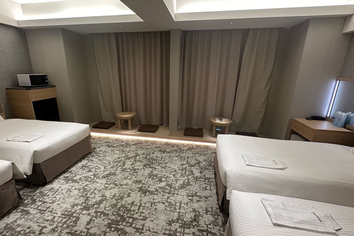Deluxe Quadruple Room (4 Single Beds), Non Smoking | In-room safe, blackout drapes, soundproofing, bed sheets