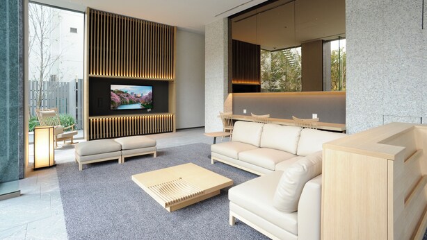A modern living room with a large flat-screen TV, a sofa, a coffee table, and a dining area. - Hotel Keihan Tsukiji Ginza Grande (Tokyo)