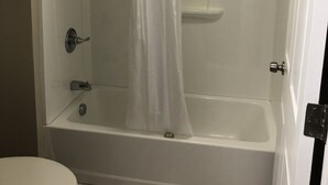 A bathroom with a bathtub, shower, and toilet. - FairBridge Inn Express Memphis (Memphis)