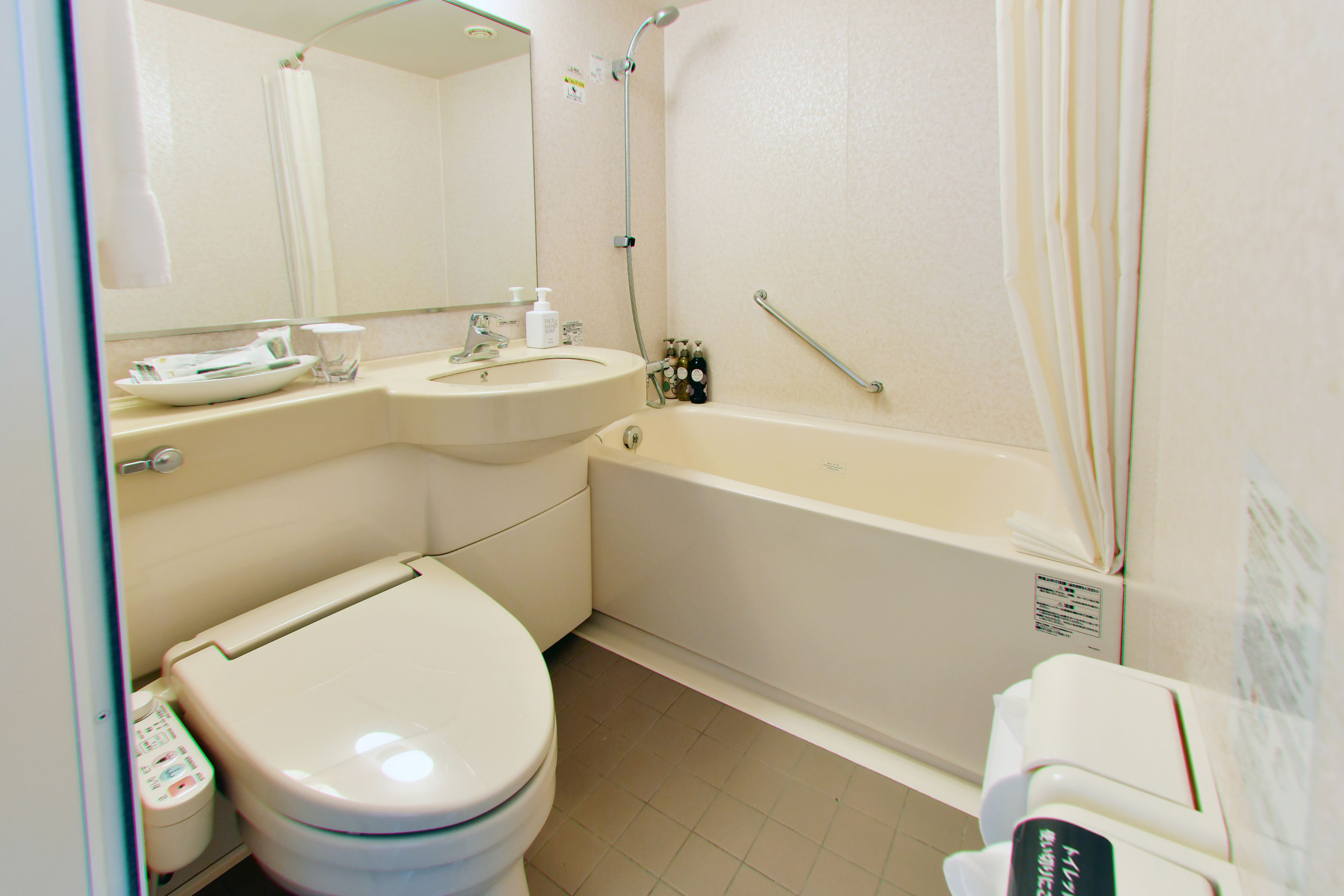 combined shower/bathtub, free toiletries, hair dryer, slippers