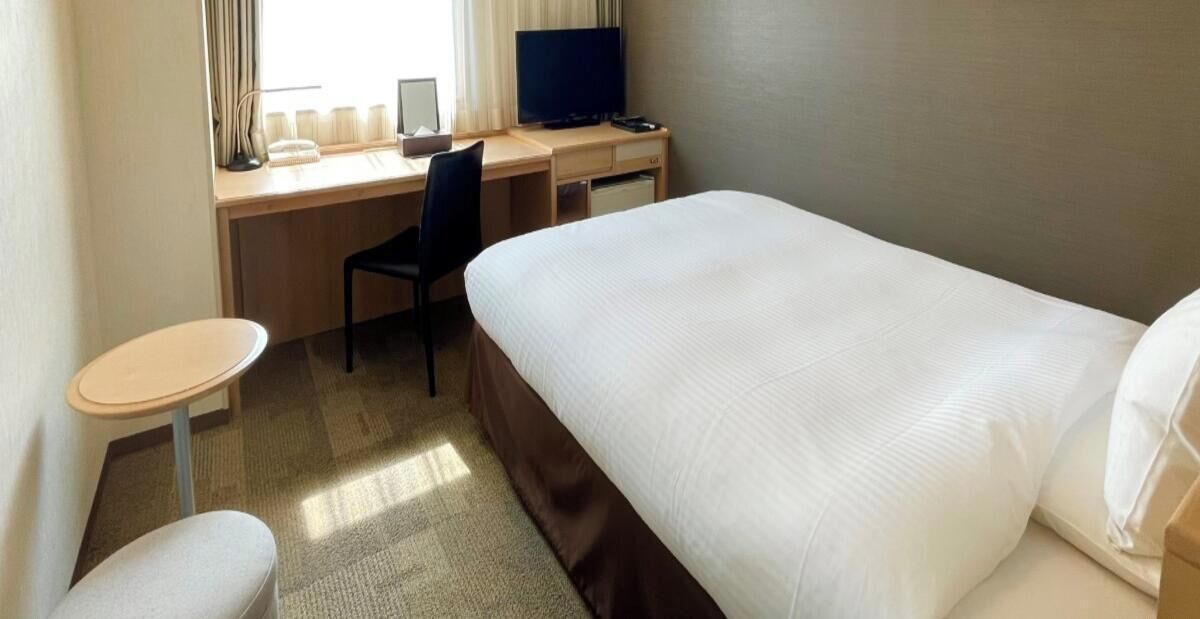 Desk, blackout drapes, iron/ironing board, rollaway beds