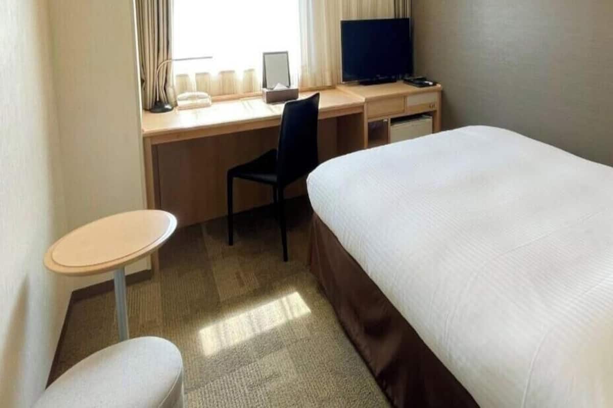 Desk, blackout drapes, iron/ironing board, rollaway beds