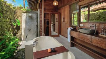 Jivana One Bedroom Villa | Bathroom | Combined shower/tub, jetted tub, rainfall showerhead, free toiletries