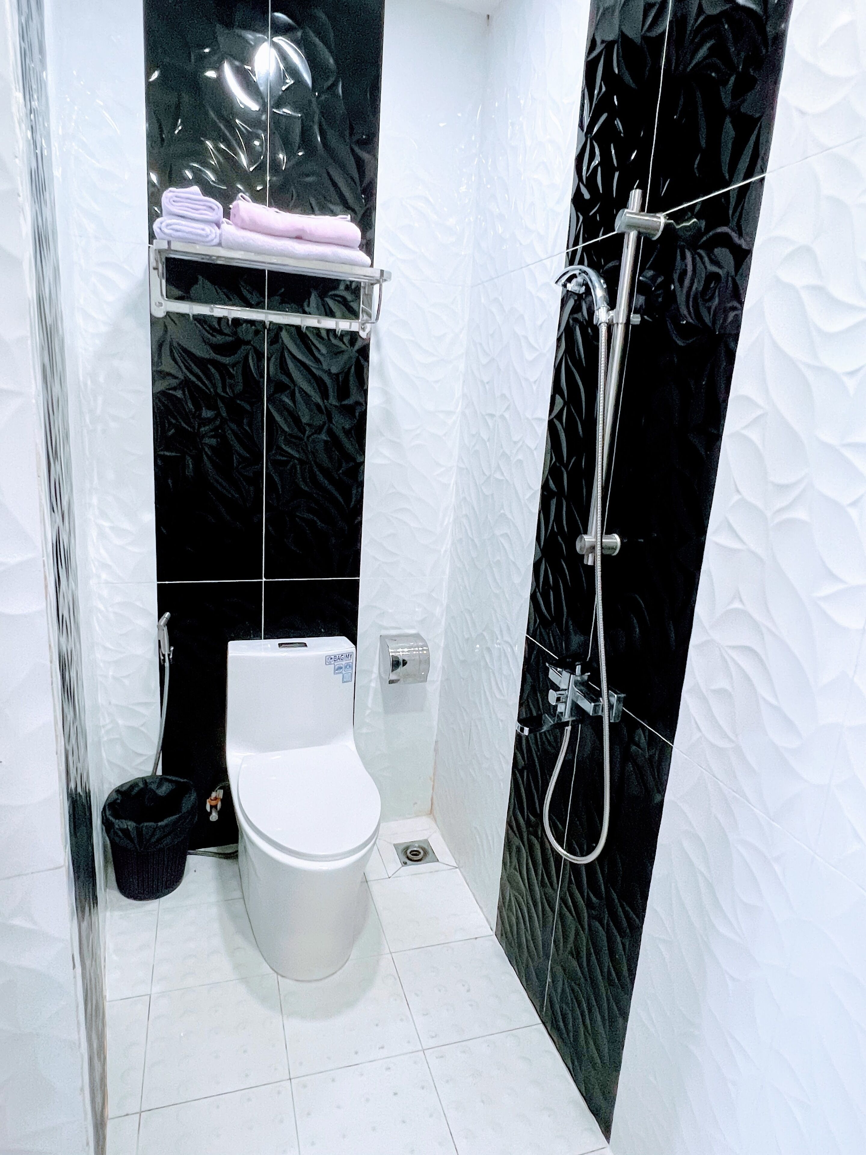 deluxe room, 1 queen bed | bathroom | shower, free toiletries, hair dryer, slippers