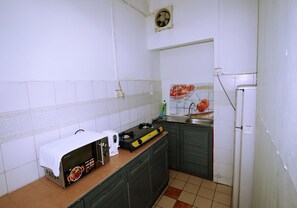 Studio | Private kitchenette | Full-size fridge, microwave, stovetop, electric kettle - Studio Apartment @ KK City Center (Kota Kinabalu)