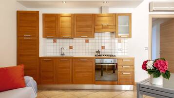 Apartment, 1 Bedroom | Private kitchen | Full-sized fridge, stovetop