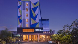 A modern hotel with a geometric facade, multiple windows, and a visible brand name. - Aston Inn Tasikmalaya (Tasikmalaya)