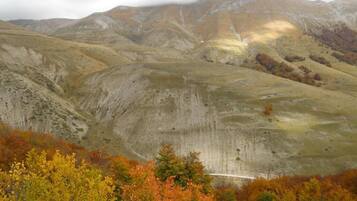 A mountainous landscape with autumn foliage.