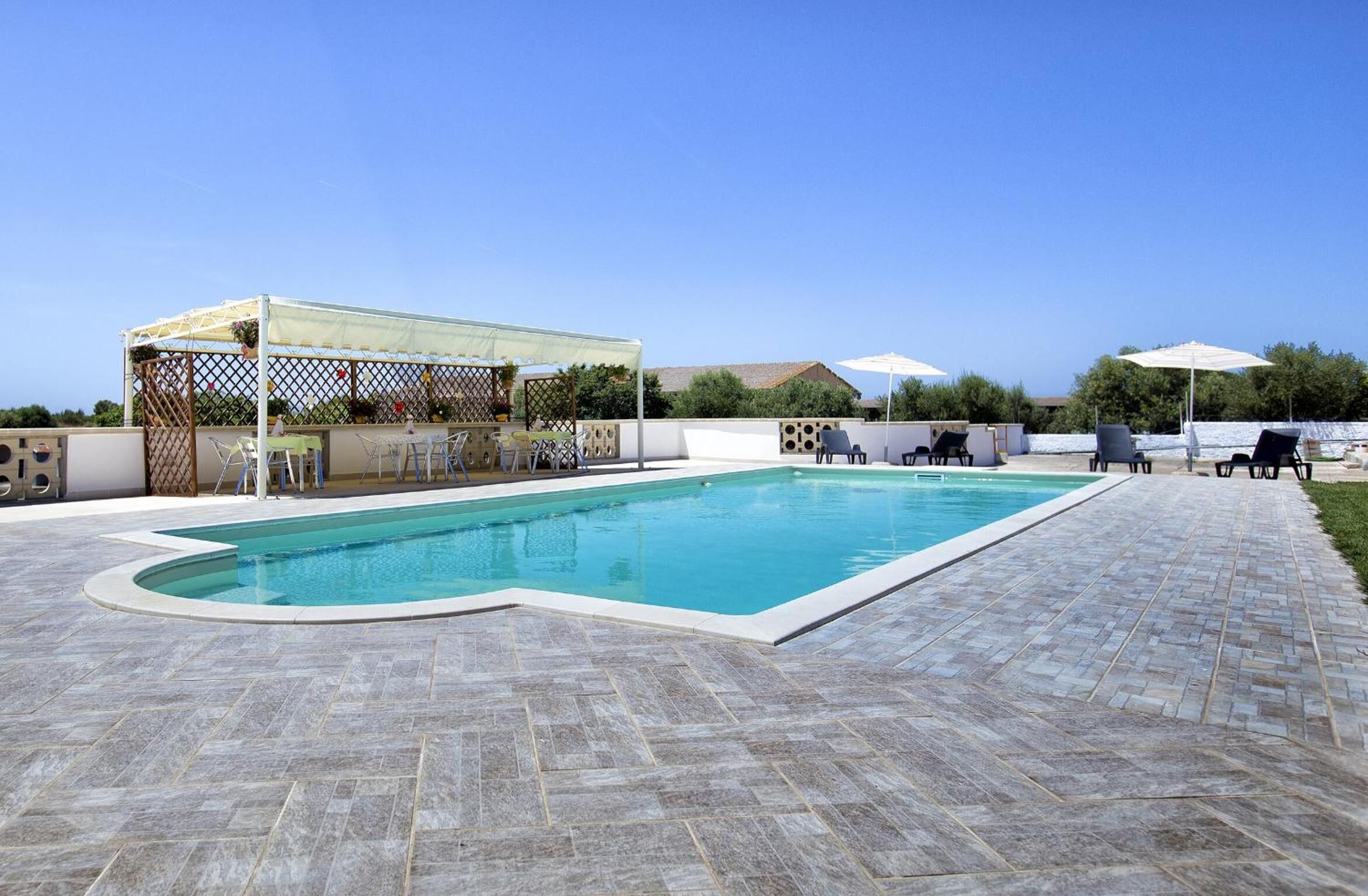 Seasonal outdoor pool, pool umbrellas, pool loungers