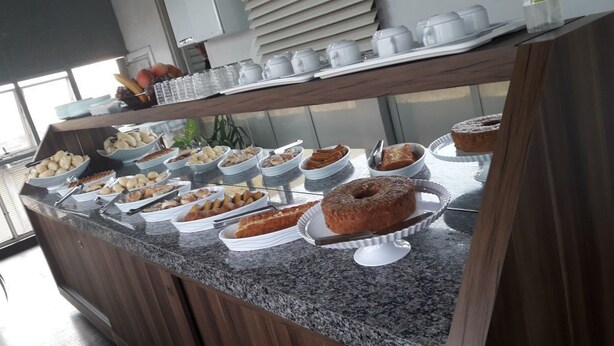 A buffet with various baked goods and pastries. - D'arc Hotel (Goiania)