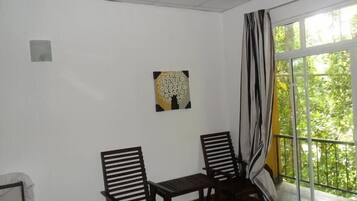 Economy Double Room Single Use, 1 King Bed, River View, Garden Area | Living area | Flat-screen TV
