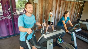 A gym with stationary bikes and treadmills.