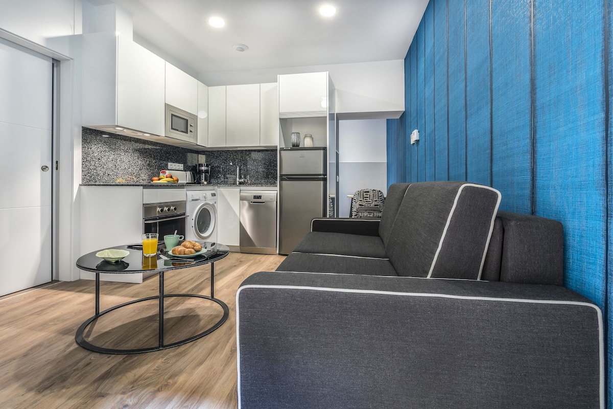 Standard Apartment, 2 Double Beds | Living area | Flat-screen TV