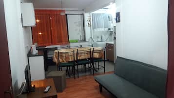 Apartment, 3 Bedrooms | Living area | Flat-screen TV