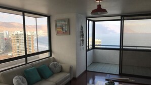 Apartment, 1 Bedroom | Living area | Flat-screen TV, DVD player - Depto Península Cavancha Iquique 1124 (Iquique)