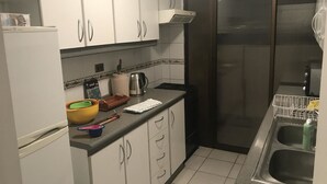 Apartment, 1 Bedroom | Private kitchen | Fridge, microwave, electric kettle, cookware/dishes/utensils - Depto Península Cavancha Iquique 1124 (Iquique)