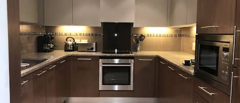 2 Bedroom Apartment | Private kitchen | Full-sized fridge, microwave, oven, stovetop
